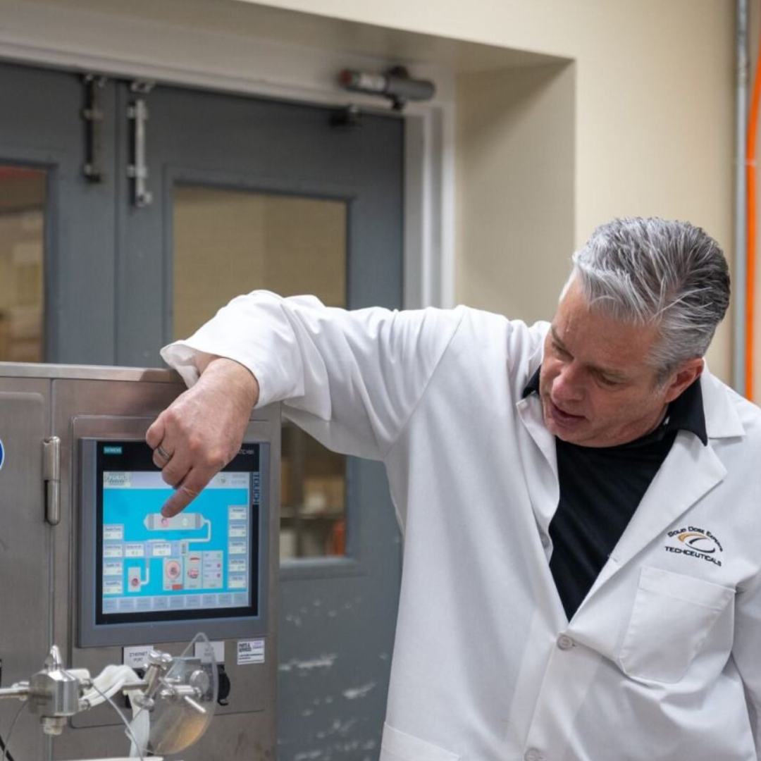 Jim Marjeram at Techceuticals training tablet coating machine